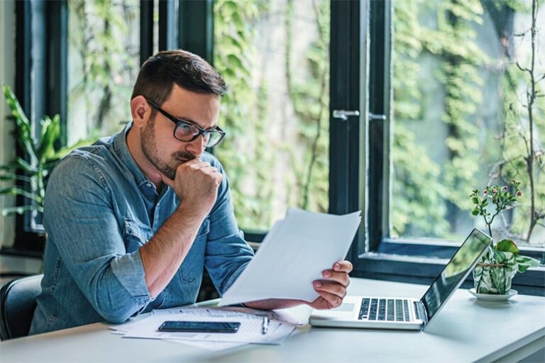 Small business bookkeeper reviewing reports.